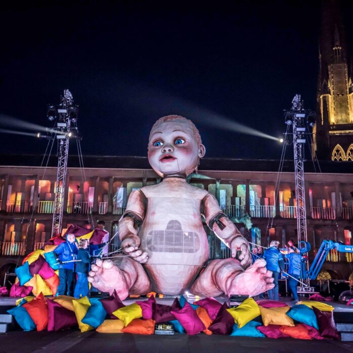 Zara, Mind the gap's production. Giant Baby, projections at Piece Hall, Halifax