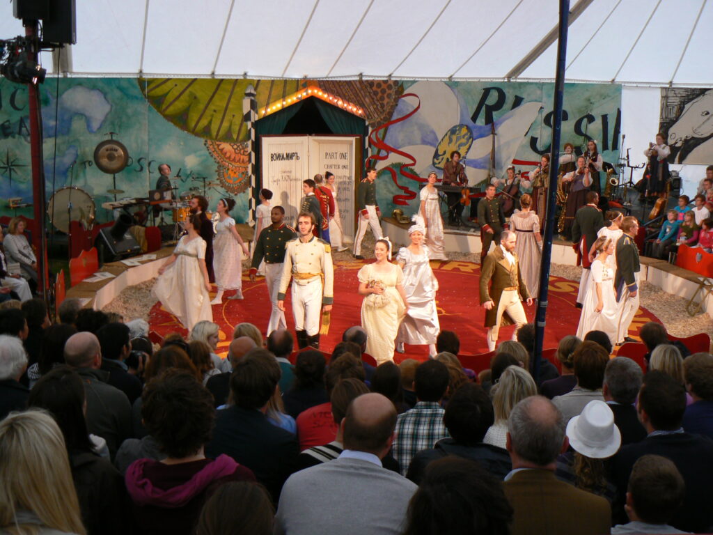 Giffords Circus War and Peace company in ring dancing in period costume